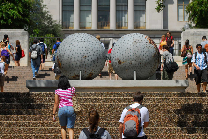 Two large spheres with pennies affixed