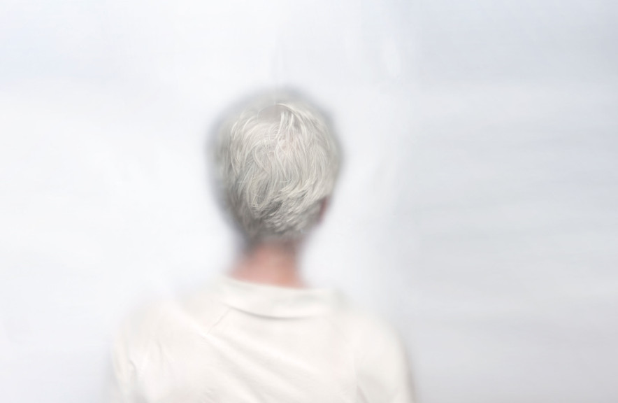 A woman with shirt grey hair