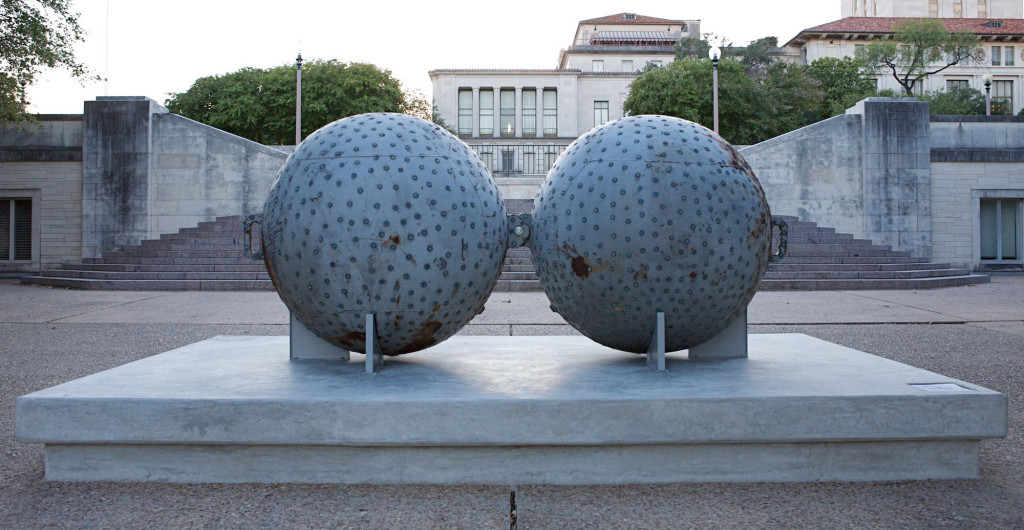 Two large spheres with pennies affixed