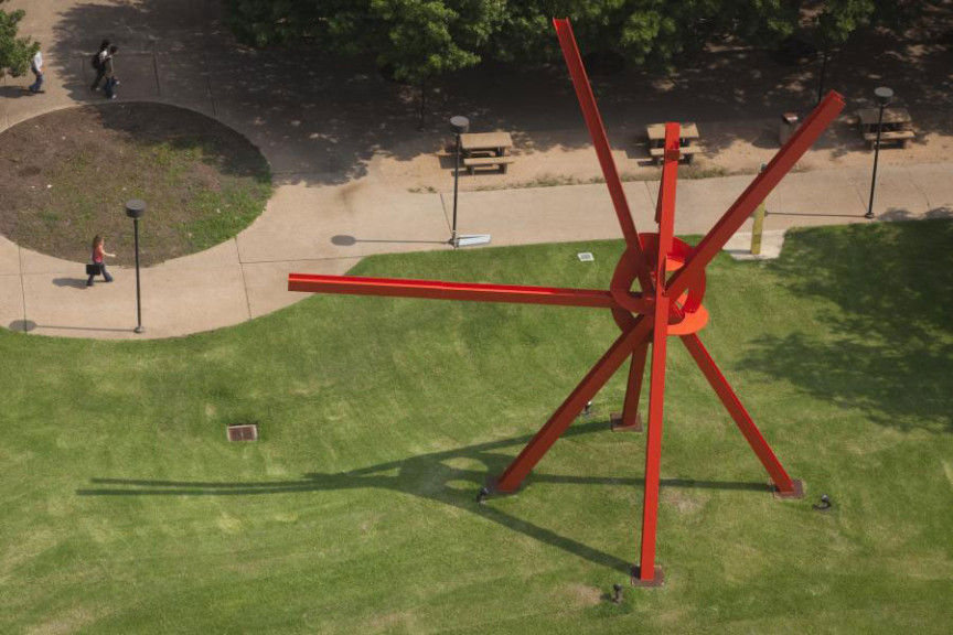 A large red metal sculpture