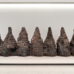 Seven mountain shaped objects made from wood blocks