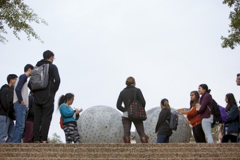 Students in front of sculpture