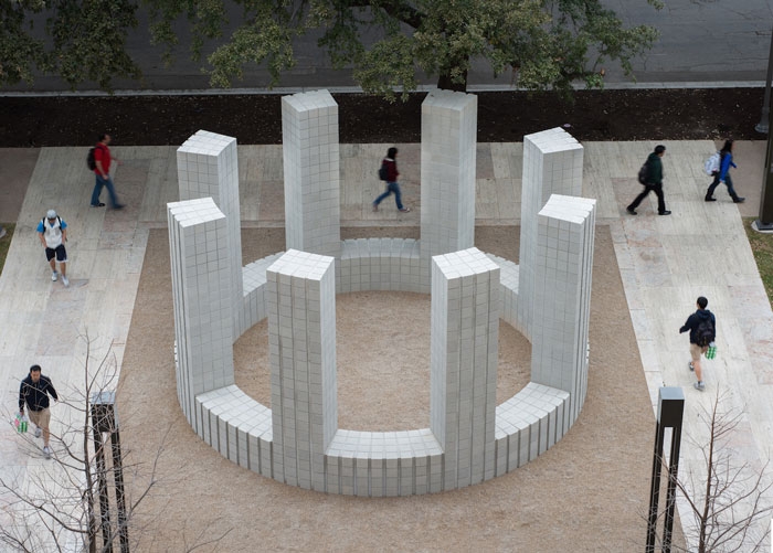 A circular structure with towers made of concrete blocks