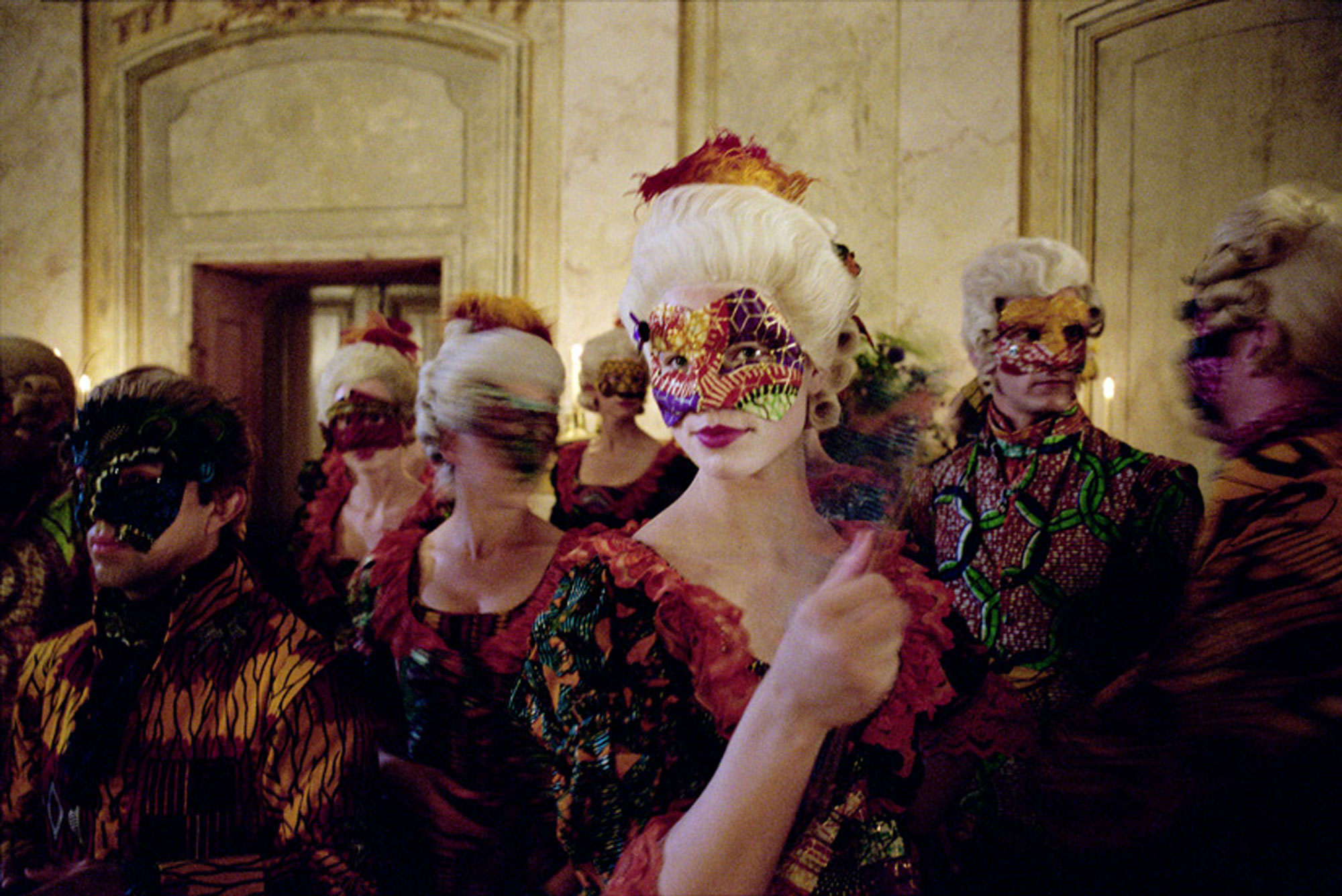 A masked woman at a masquerade 