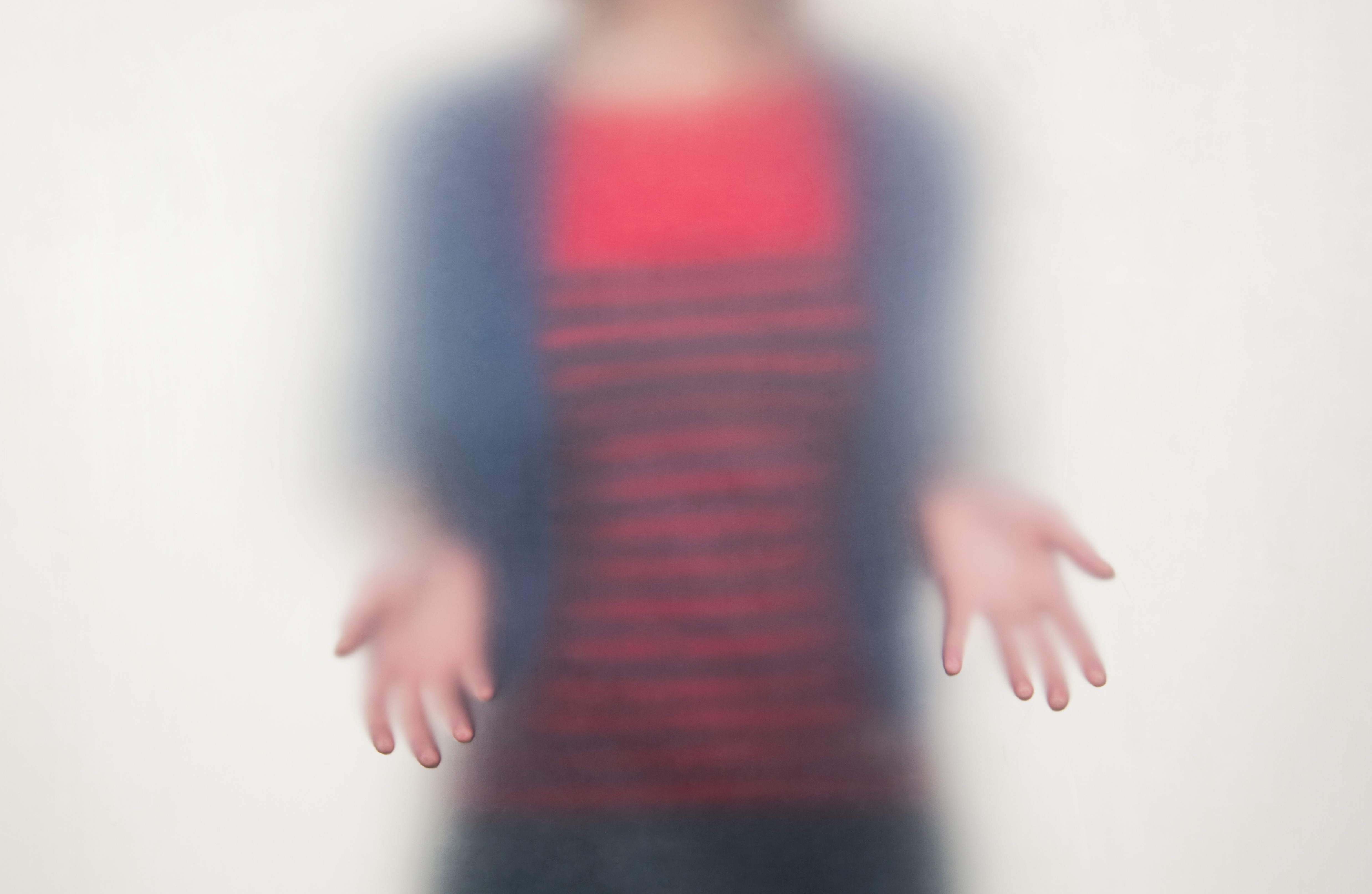 woman in stripped shirt holding out hands