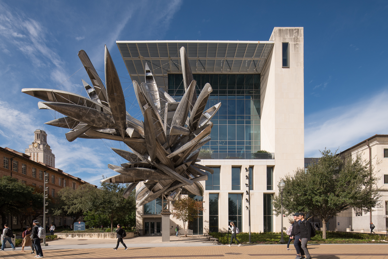 An Image of Nancy Rubin's "Monochrome for Austin" with a building right behind it and the UT tower.