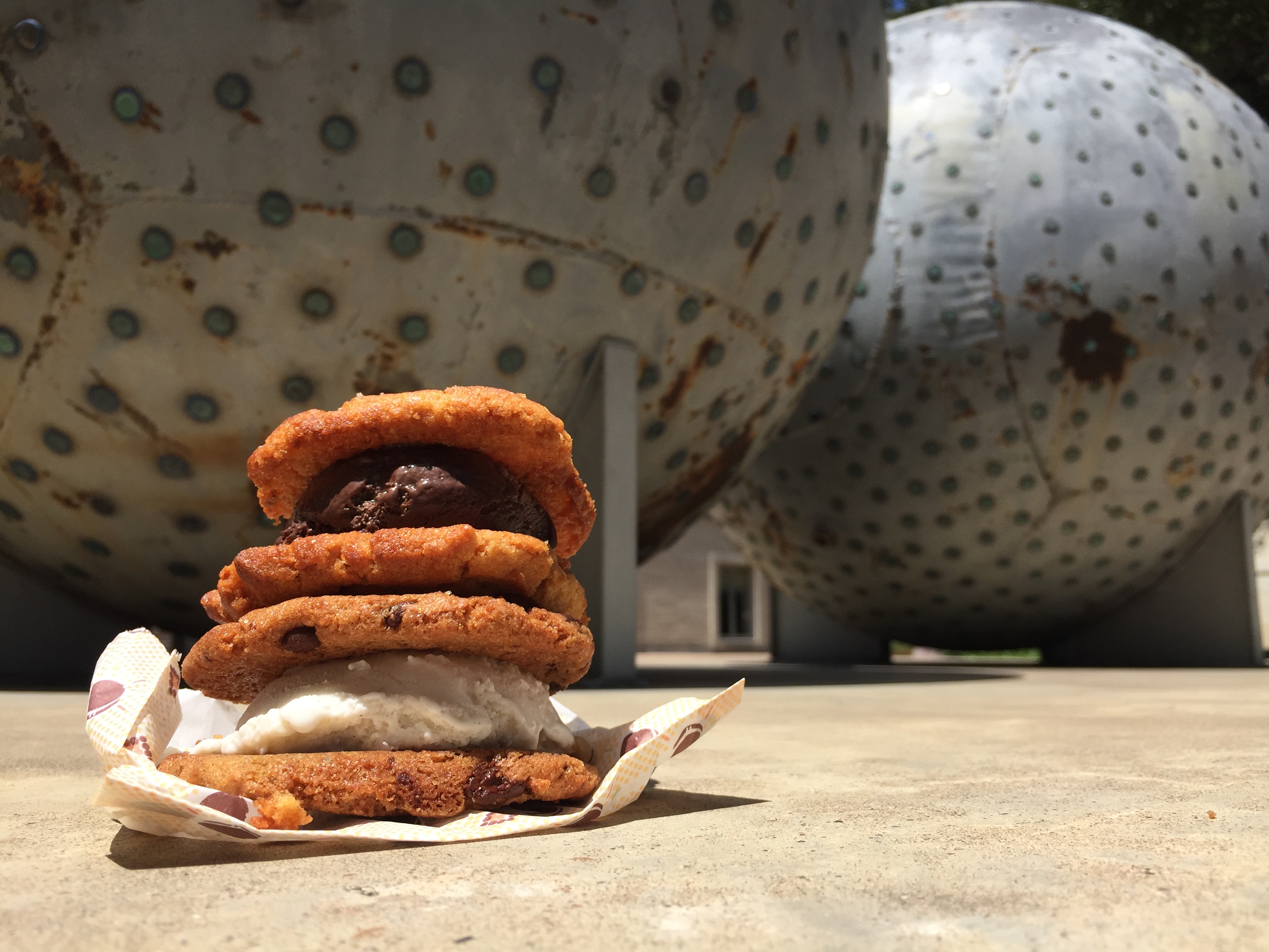 Ice cream sandwiches in front of sculpture