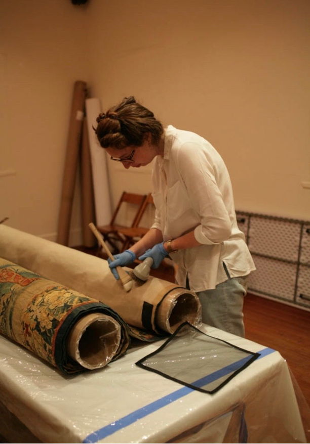 Picture of a student cleaning textiles 