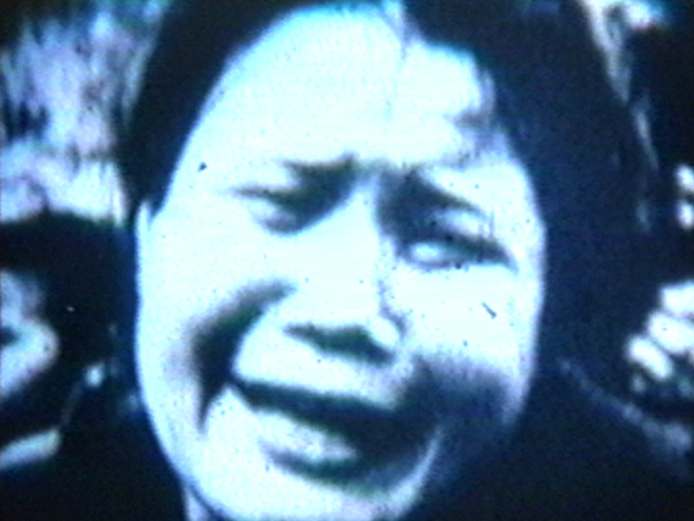 Film still of woman crying