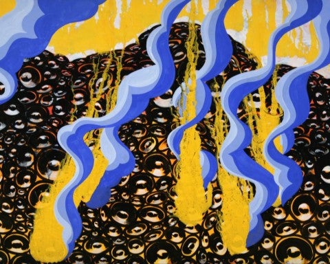 A still from David Ellis' "Animal." In this still there appears to be a field of speakers which have yellow explosions and blue smoke emanating from the ground 