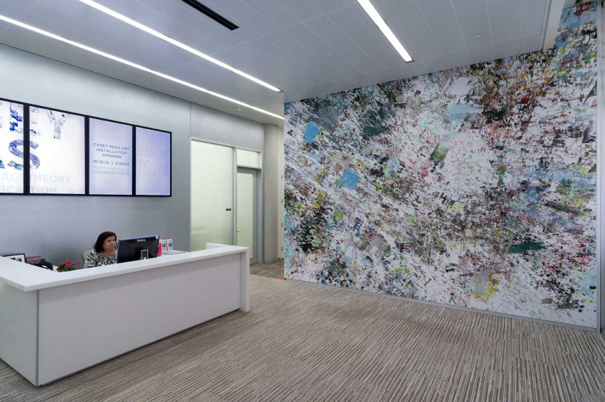 An office with a large wall mural