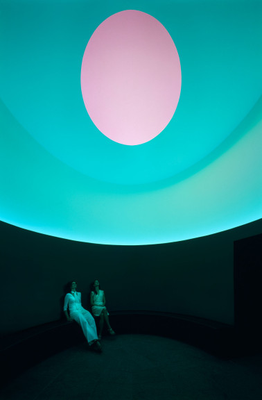 Two figures inside a cylindrical room with an oculus overhead
