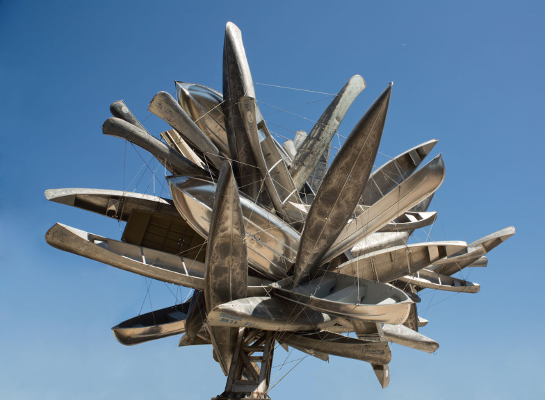 A large sculpture of metal boats
