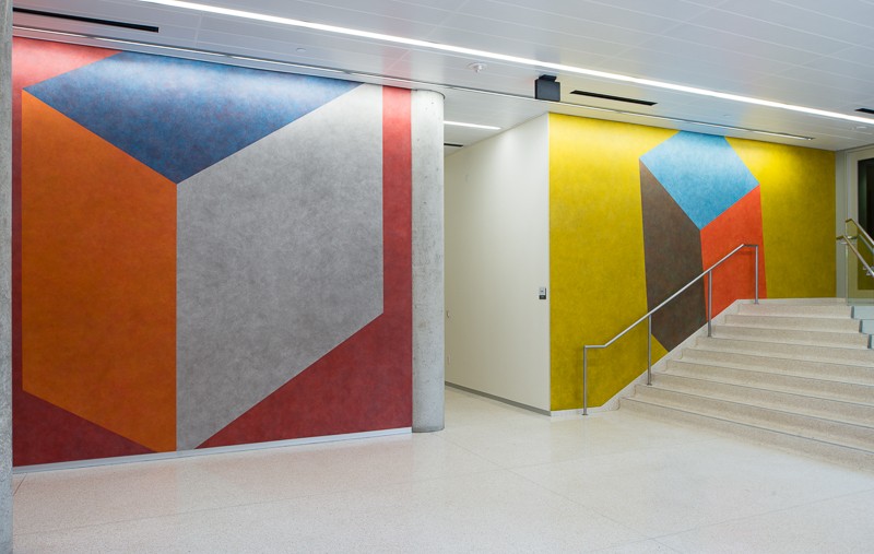 two walls with colorful shapes on it