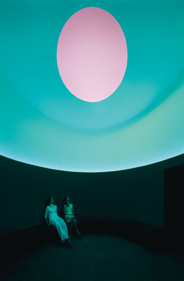 Two figures under a colorful oculus