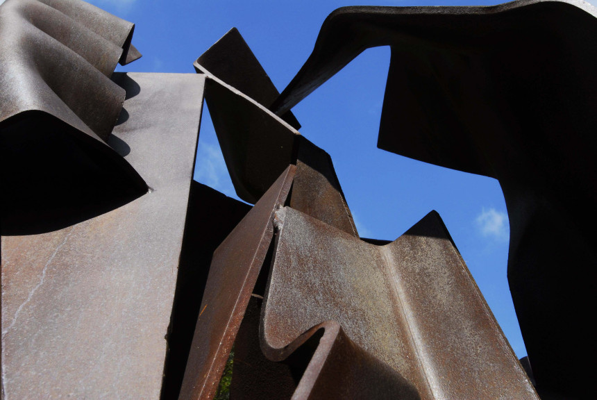 Close up of sculpture with blue sky showing through spaces