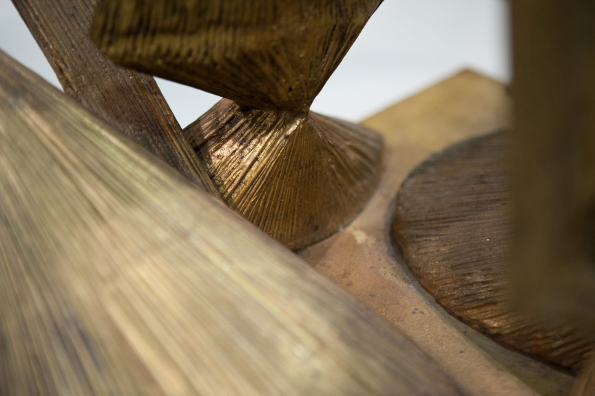 detail of textured wooden sculpture with lines going different directions