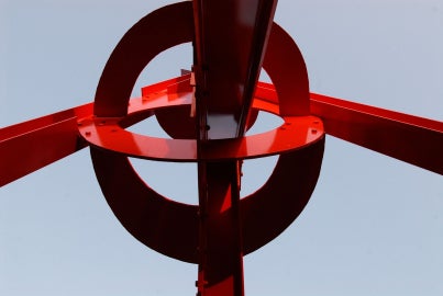 A large red metal sculpture