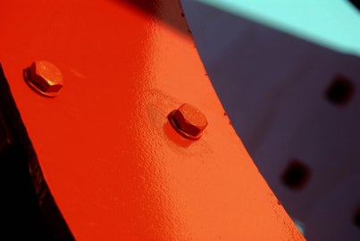 A large red metal sculpture