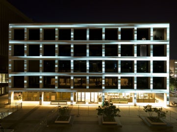 building with text projected on it, blurred from motion
