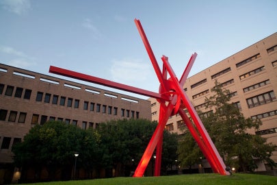 A large red metal sculpture