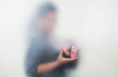 Someone holding a baby's feet