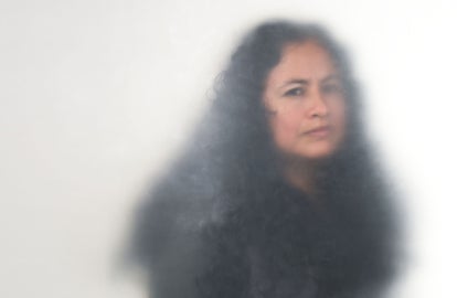 A woman with wavy black hair