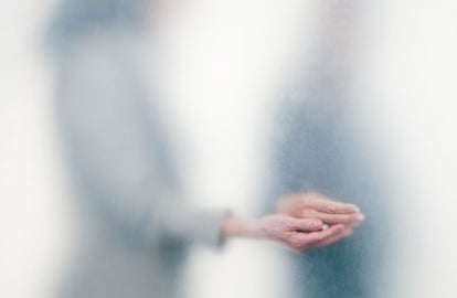 Two people touching hands