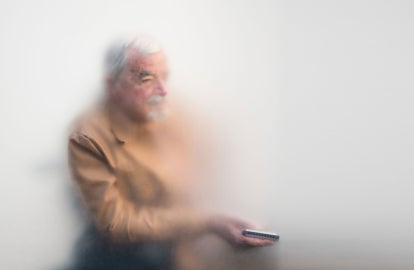 An older man in a wheelchair