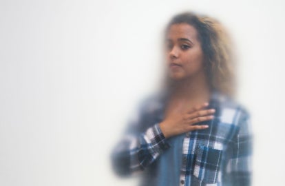 A woman touching her heart