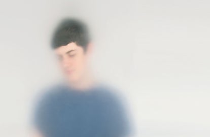 A young man with a blue shirt