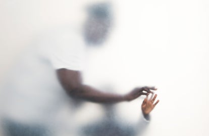 A man touching a child's hand