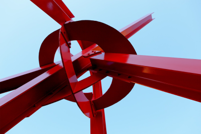 A large red metal sculpture 