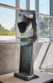 A metal half circle with a flat metal bottom