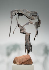A sculpture mounted on a rock