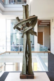large vertical sculpture in bright lit space