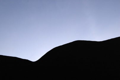 curvy shadow shape below sky