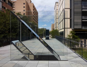 An image of Sarah Oppenheimer's "C-010106," two works cut through the surface of a pedestrian bridge.