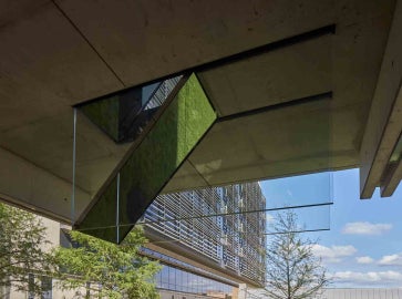  A detail of Sarah Oppenheimer's "C-010106," as seen through the underside of the bridge. The work reflect the environment around it.