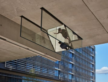 A detail of Sarah Oppenheimer's "C-010106," which shows the reflective quality of the work under the bridge.