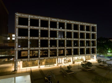 A grid-like building face with text running vertically and horizontally
