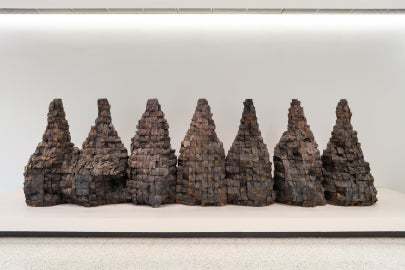 Seven mountain shaped objects made from wood blocks