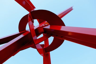A large red metal sculpture 