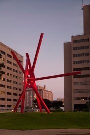 A large red metal sculpture