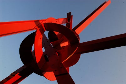 A large red metal sculpture