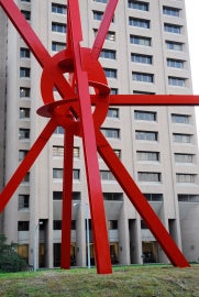 A large red metal sculpture