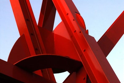 A large red metal sculpture