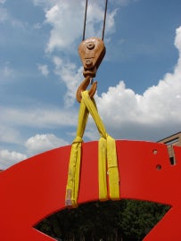 A large red metal sculpture