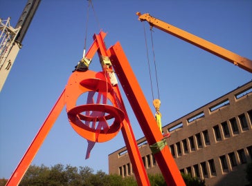 A large red metal sculpture