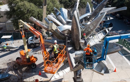 construction equipment under cluster of canoes